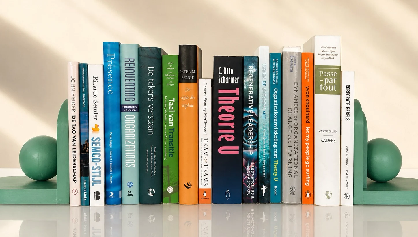 The fifteen books that shaped our model, standing between two bookends.